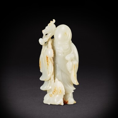 View full screen - View 1 of Lot 6892. A white and russet jade 'Shoulao and deer' group, Qing dynasty, 18th century | 清十八世紀 白玉壽老瑞鹿.