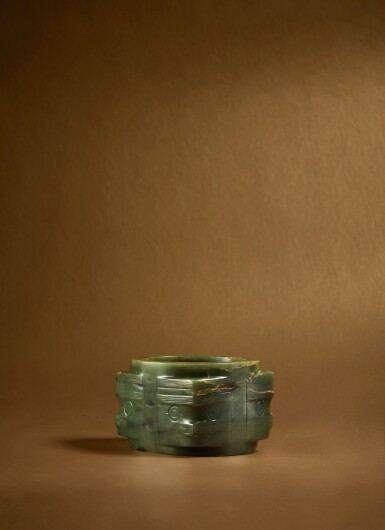 View full screen - View 1 of Lot 97. An archaic dark green jade ‘mask’ cong, Neolithic period, Liangzhu culture .