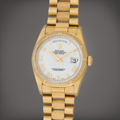 View full screen - View 1 of Lot 131. Day-Date, Reference 18248 | A yellow gold wristwatch with day, date, bracelet and bark finish | Circa 1999 .