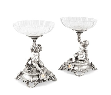 View full screen - View 1 of Lot 275. A pair of silver-plated bronze and crystal fruits-stands, Christofle, Paris, 1870-1871 | Paire de compotiers en bronze argenté et cristal à décor de putti par Christofle, Paris, 1870-1871.