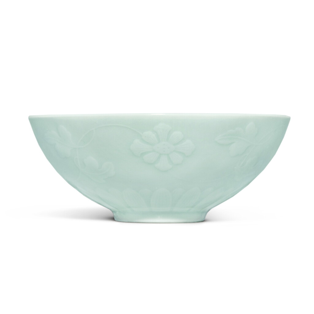 View full screen - View 1 of Lot 4. A fine molded celadon-glazed 'floral' bowl, Mark and period of Yongzheng | 清雍正 粉青釉浮雕纏枝花卉紋盌 《大清雍正年製》款.
