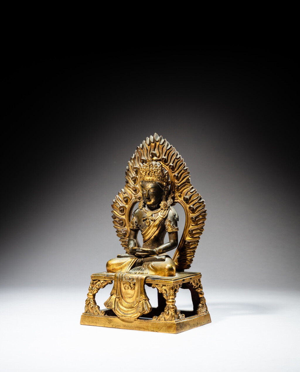 View full screen - View 1 of Lot 215. A gilt-bronze figure of Amitayus, Qing dynasty, Qianlong period | 清乾隆 鎏金銅無量壽佛坐像.