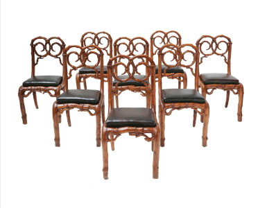 View full screen - View 1 of Lot 86. A SUITE OF EIGHT WALNUT RUSTIC CHAIRS, FRENCH OR ENGLISH, 19TH CENTURY, FROM THE COLLECTION OF PIERRE BALMAIN | SUITE DE HUIT CHAISES EN NOYER SCULPTÉ À DÉCOR NATURALISTE, FRANCE OU ANGLETERRE, XIXE SIÈCLE, PROVENANT DE LA COLLECTION DE PIERRE BALMAIN.