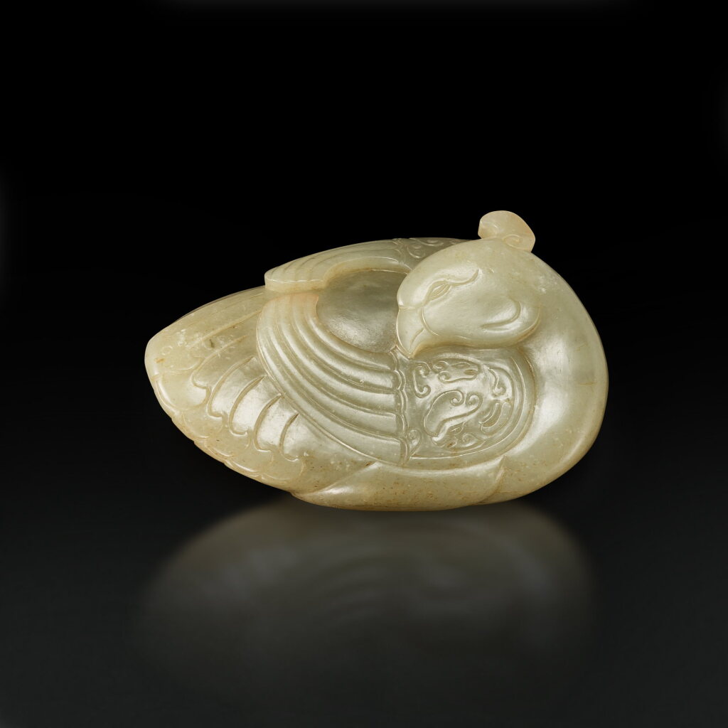 View full screen - View 1 of Lot 3673. A pale celadon and russet jade figure of a bird, 17th century | 十七世紀 青白玉瑞鳥.