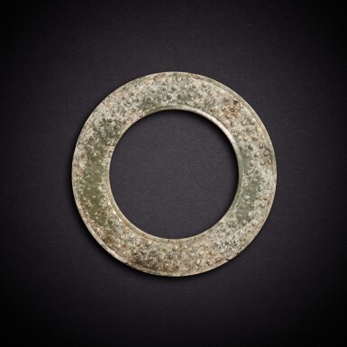 View full screen - View 1 of Lot 3509. A pale celadon jade ring, yuan, Eastern Zhou dynasty, Warring States period | 東周戰國 青白玉穀紋瑗.