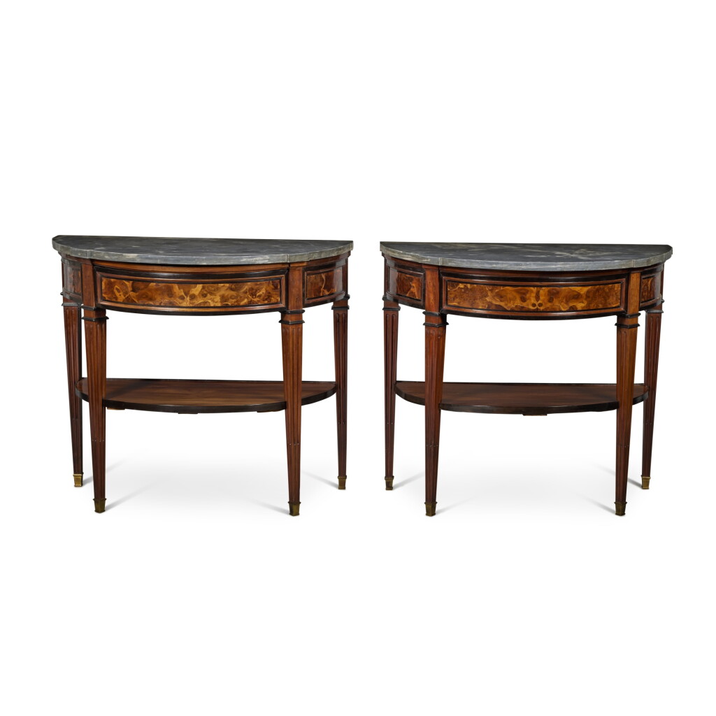 View full screen - View 1 of Lot 61. A Pair of Louis XVI Demilune Burr Yew, Mahogany and Ebonized Side Tables, Last Quarter 18th Century.
