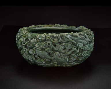 View full screen - View 1 of Lot 199. A large spinach-green jade ‘dragon’ washer, Qing dynasty, 18th / 19th century | 清十八 / 十九世紀 碧玉五龍戲珠紋洗.