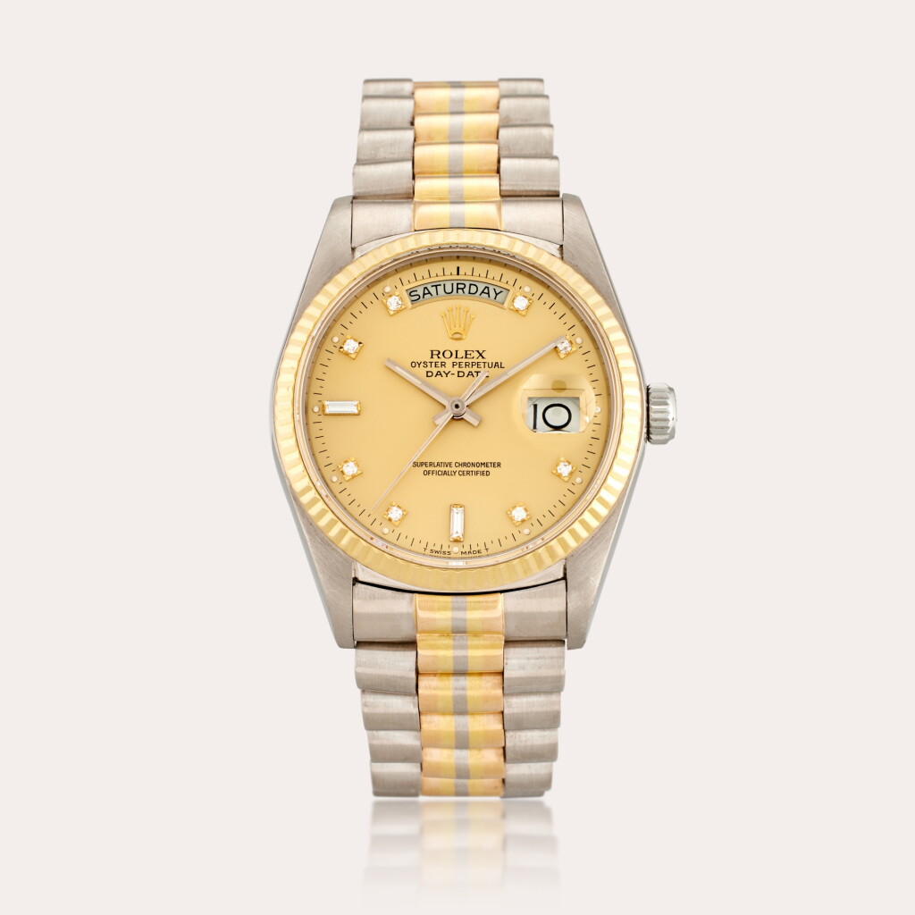 View full screen - View 1 of Lot 560. Reference 18039B Day-Date ‘Tridor’ | A yellow, pink, and white gold and diamond-set automatic wristwatch with day, date, and bracelet, Circa 1985.