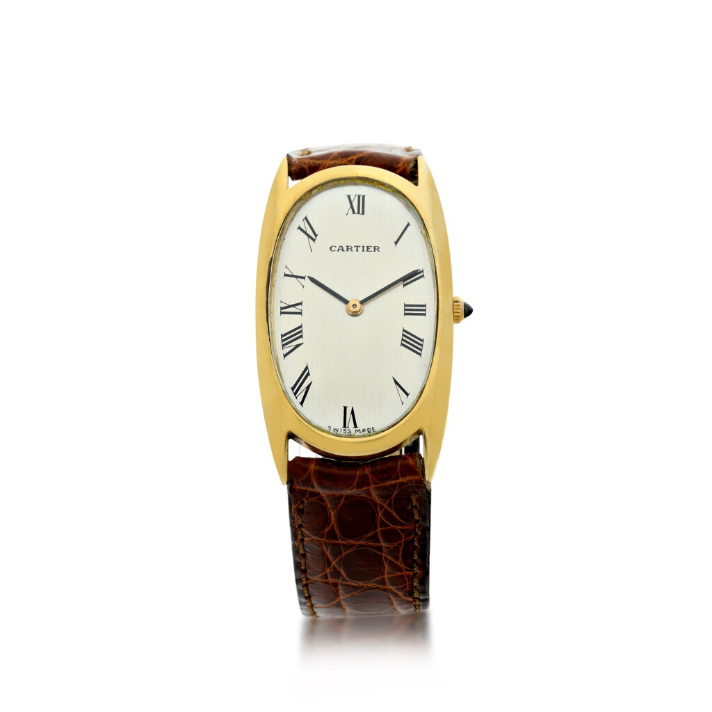 View full screen - View 1 of Lot 72. RETAILED BY CARTIER: A YELLOW GOLD OVAL WRISTWATCH, CIRCA 1960.