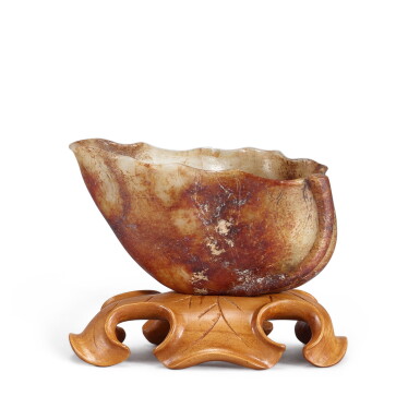 View full screen - View 1 of Lot 489. A celadon and russet jade 'lotus' cup, Yuan - Ming dynasty 元至明 玉雕蓮花盃 .