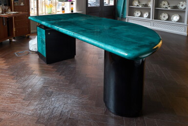 View full screen - View 1 of Lot 63. A desk by Aldo Tura and a cast bronze standard lamp by Luciano Frigerio, Italy, second half 20th century.