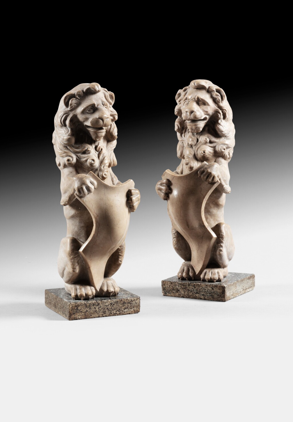 View full screen - View 1 of Lot 52. A pair of standing lions holding a shield of arms.