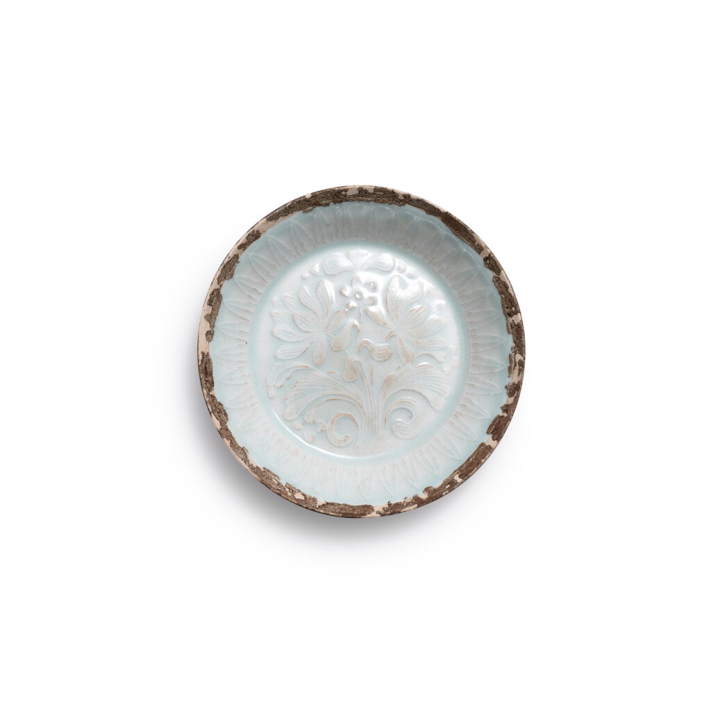 View full screen - View 1 of Lot 9538. A qingbai-glazed 'lotus' dish, Southern Song dynasty | 南宋 錫釦青白釉模印並蒂蓮紋碟.
