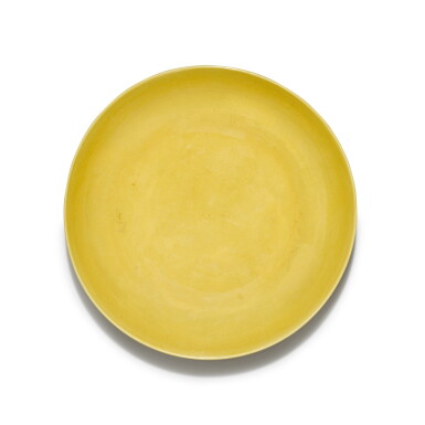 View full screen - View 1 of Lot 5. A yellow-glazed 'lotus' dish, Mark and period of Yongzheng | 清雍正 黃釉刻蓮紋盤 《大清雍正年製》款.