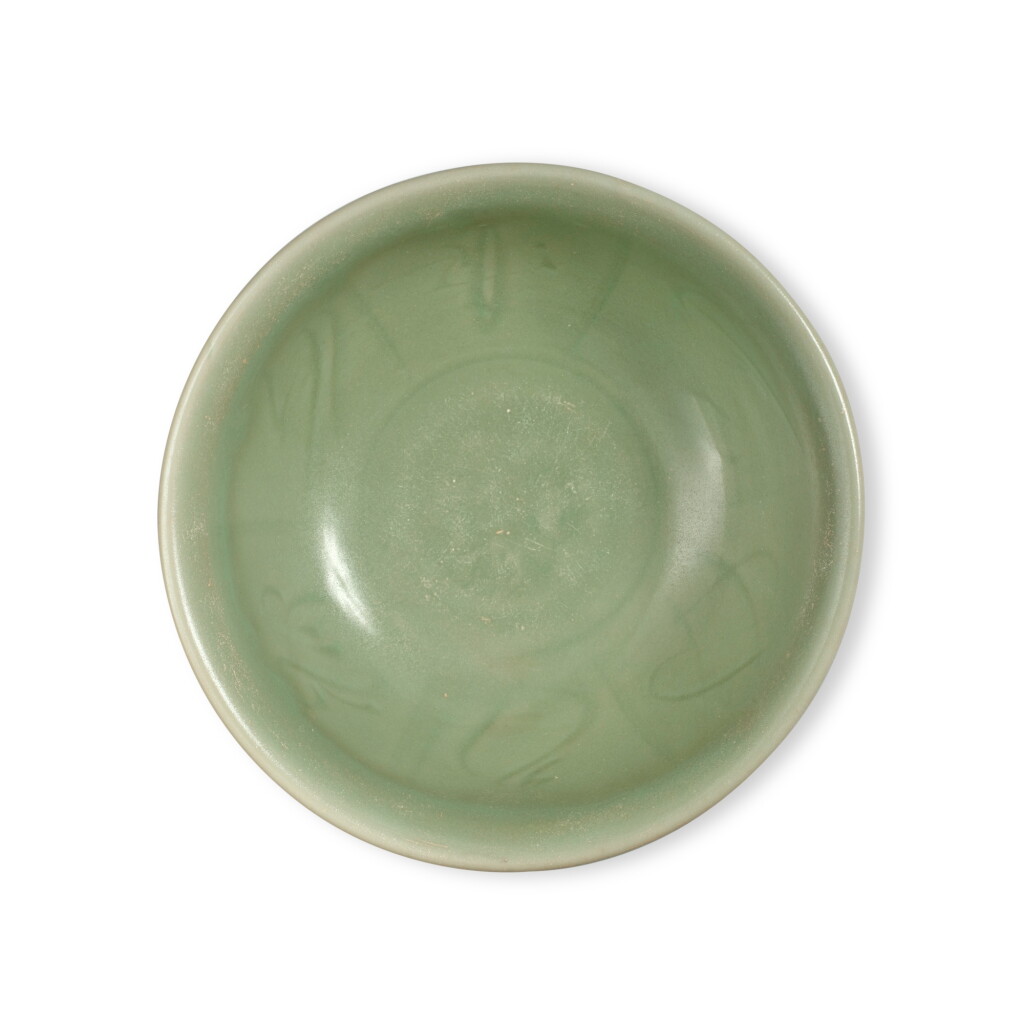 View full screen - View 1 of Lot 670. A carved 'Longquan' celadon-glazed bowl, Ming dynasty | 明 龍泉窰青釉刻花紋盌.