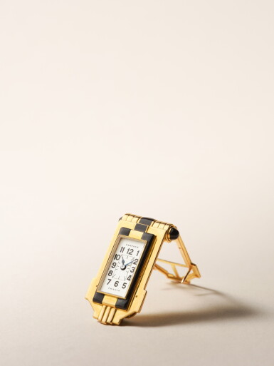 View full screen - View 1 of Lot 2277. A yellow gold and black enamel Egyptian revival Art Deco clip watch, Circa 1930 .