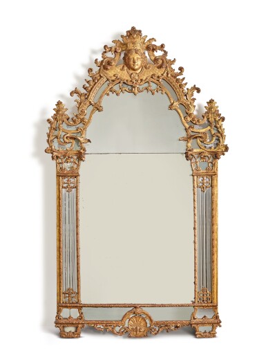 View full screen - View 1 of Lot 256. A RÉGENCE CARVED AND GILTWOOD MIRROR, CIRCA 1720.