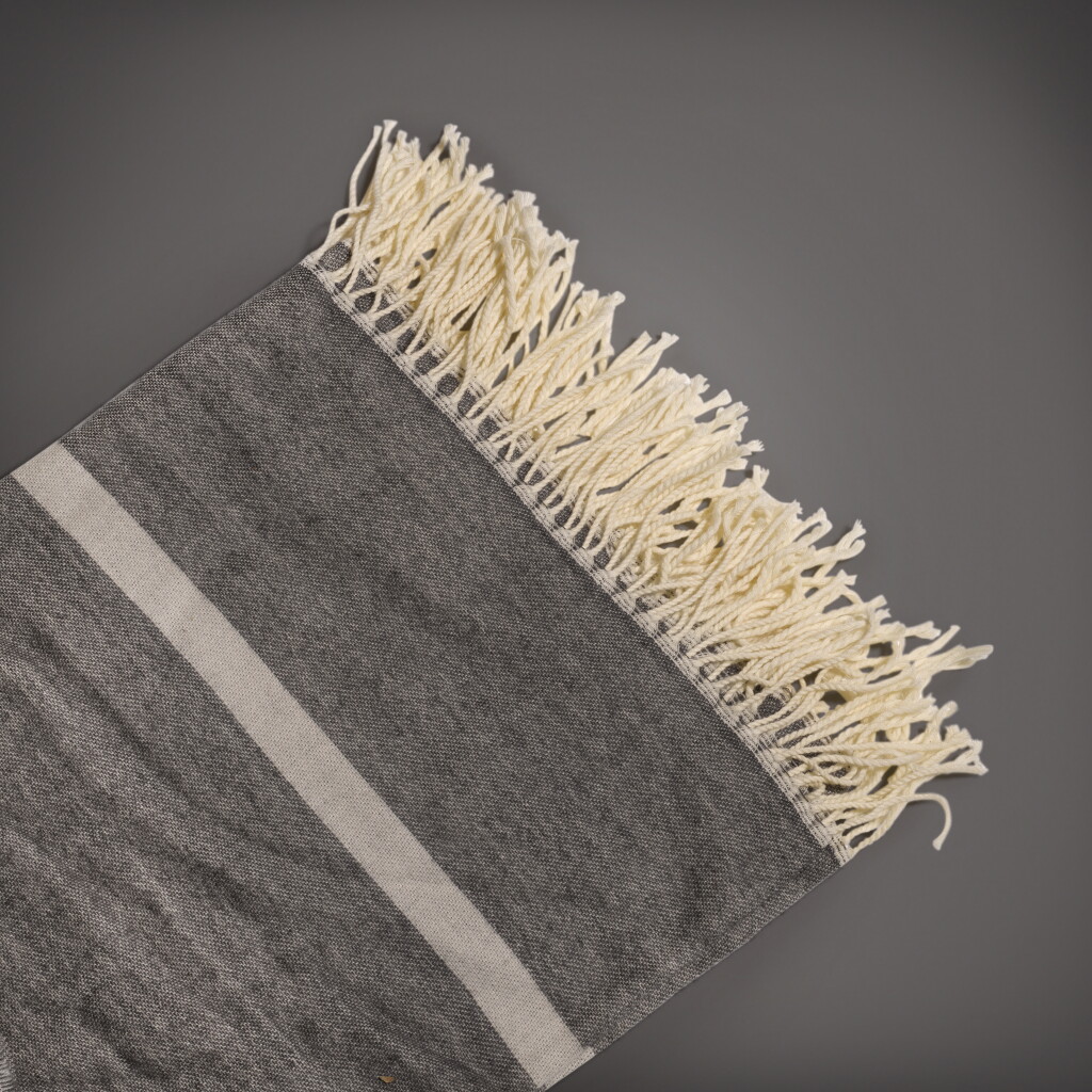 View full screen - View 1 of Lot 77. A grey and white lambswool blanket | Circa 2018.