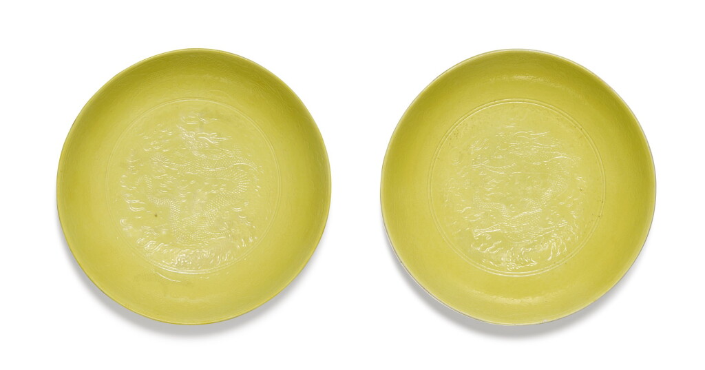 View full screen - View 1 of Lot 150. A pair of incised yellow-glazed ‘dragon’ dishes Marks and period of Guangxu | 清光緒 黃釉暗刻趕珠遊龍紋盤一對 《大清光緒年製》款.