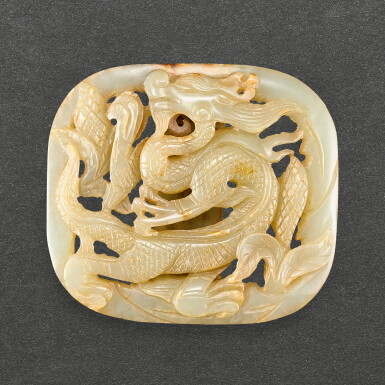 View full screen - View 1 of Lot 544. A CELADON JADE RETICULATED 'DRAGON' BELT BUCKLE LIAO - YUAN DYNASTY | 遼至元 青白玉鏤雕龍紋帶扣.