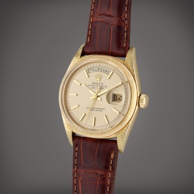 View full screen - View 1 of Lot 41. Reference 1806 Day-Date ‘Florentine’ | A yellow gold automatic wristwatch with day, date, and textured linen etched case, Circa 1960.