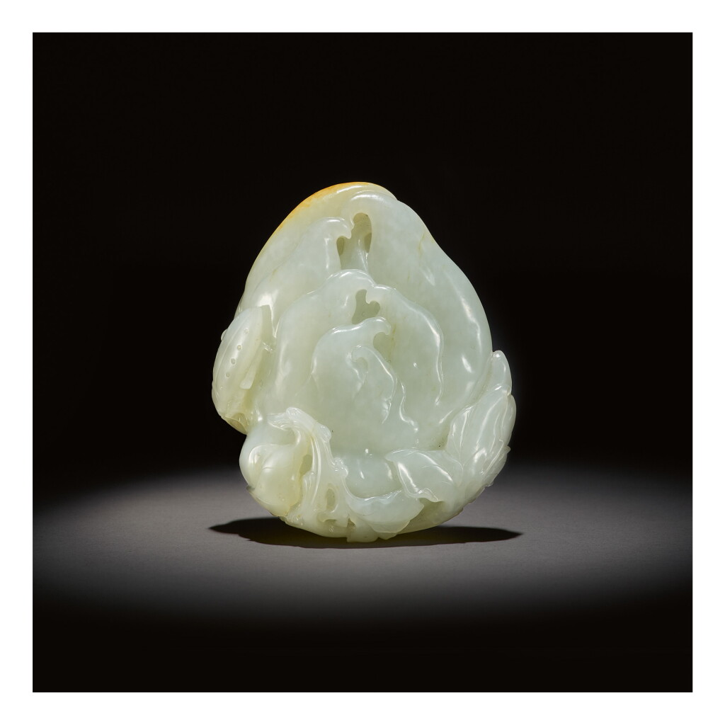 View full screen - View 1 of Lot 219. A WHITE AND RUSSET JADE CARVING OF A FINGER CITRON, QING DYNASTY, QIANLONG PERIOD.