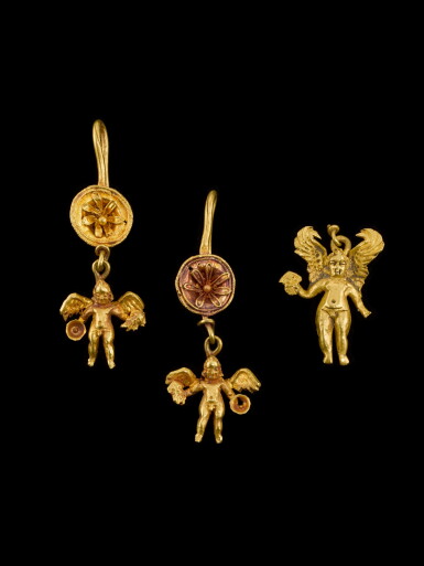 View full screen - View 1 of Lot 3. A Pair of Hellenistic Gold-Disk-and-Eros-Pendant-Earrings and a Gold Eros Pendant, circa 2nd half of the 3rd century B.C.