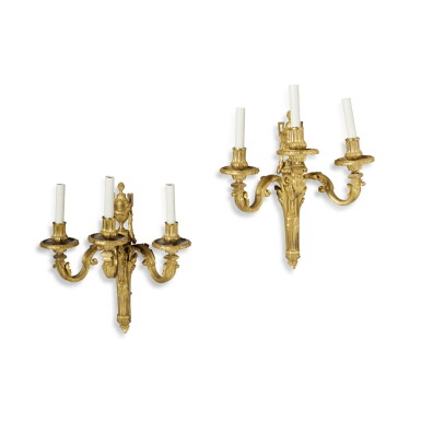 View full screen - View 1 of Lot 460. A Pair of Louis XVI Style Gilt-Bronze Three Branch Wall-Lights, Second Quarter 19th Century.