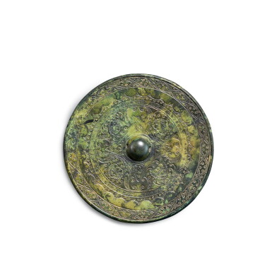 View full screen - View 1 of Lot 8903. An inscribed bronze 'feline mask' mirror, Eastern Han dynasty | 東漢 丙午神獸紋銅鏡.