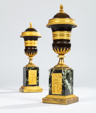 View full screen - View 1 of Lot 9. A pair of Empire style gilt and patinated bronze cassolettes, late 19th century | Paire de cassolettes formant flambeaux en bronze doré et patiné de style Empire, fin du XIXe siècle.