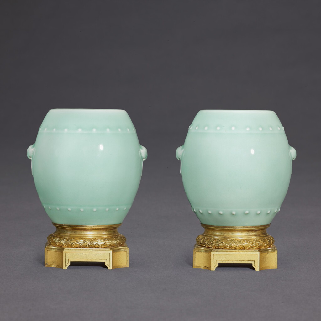 View full screen - View 1 of Lot 3514. A pair of celadon-glazed drum-shaped vases, Seal marks and period of Qianlong, the stands French, by Henri Dasson, dated 1882 | 清乾隆 粉青釉鼓式花插一對 《大清乾隆年製》款 配1882年 Henri Dasson 製法國底座.