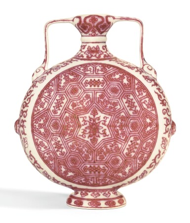 View full screen - View 1 of Lot 156. A RARE MING-STYLE COPPER-RED DECORATED MOONFLASK QIANLONG SEAL MARK AND PERIOD | 清乾隆 釉裏紅蓮花錦紋如意耳抱月瓶 《大清乾隆年製》款.