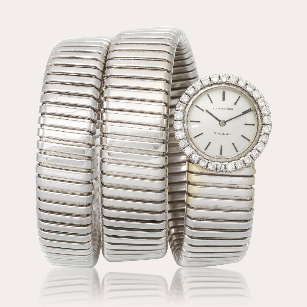 View full screen - View 1 of Lot 134. Tubogas, Reference 118 | A white gold and diamond-set bracelet watch | Circa 1970 .