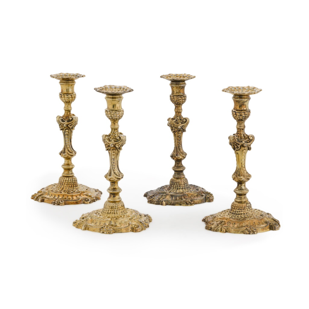 View full screen - View 1 of Lot 25. A set of four George II silver-gilt candlesticks, John Preist, London, 1752.