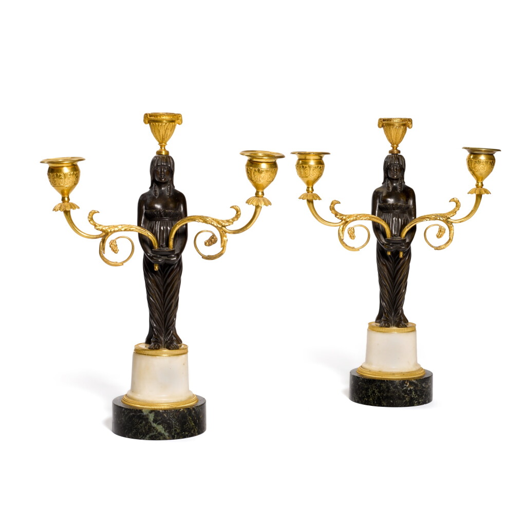View full screen - View 1 of Lot 106. A pair of George III gilt-bronze and bronze triple-light candelabra, early 19th century.