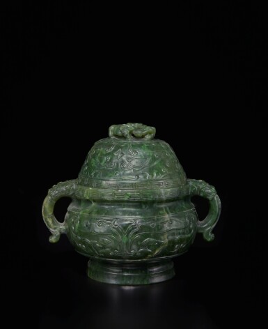 View full screen - View 1 of Lot 457. A spinach-green jade 'taotie' censer and cover, Qing dynasty, 19th century | 清十九世紀 碧玉雕饕餮紋獸首耳蓋爐.