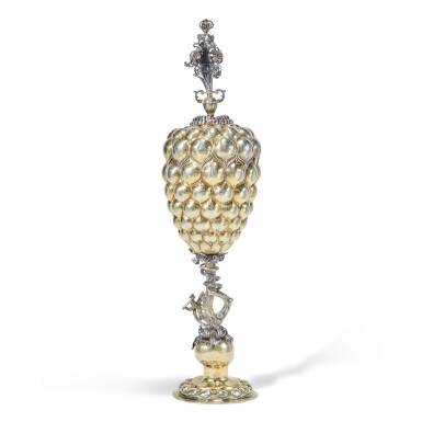 View full screen - View 1 of Lot 73. A TALL GERMAN SILVER-GILT COVERED CUP (TRAUBENPOKAL), ESAIAS ZUR LINDEN, NUREMBERG, CIRCA 1610.