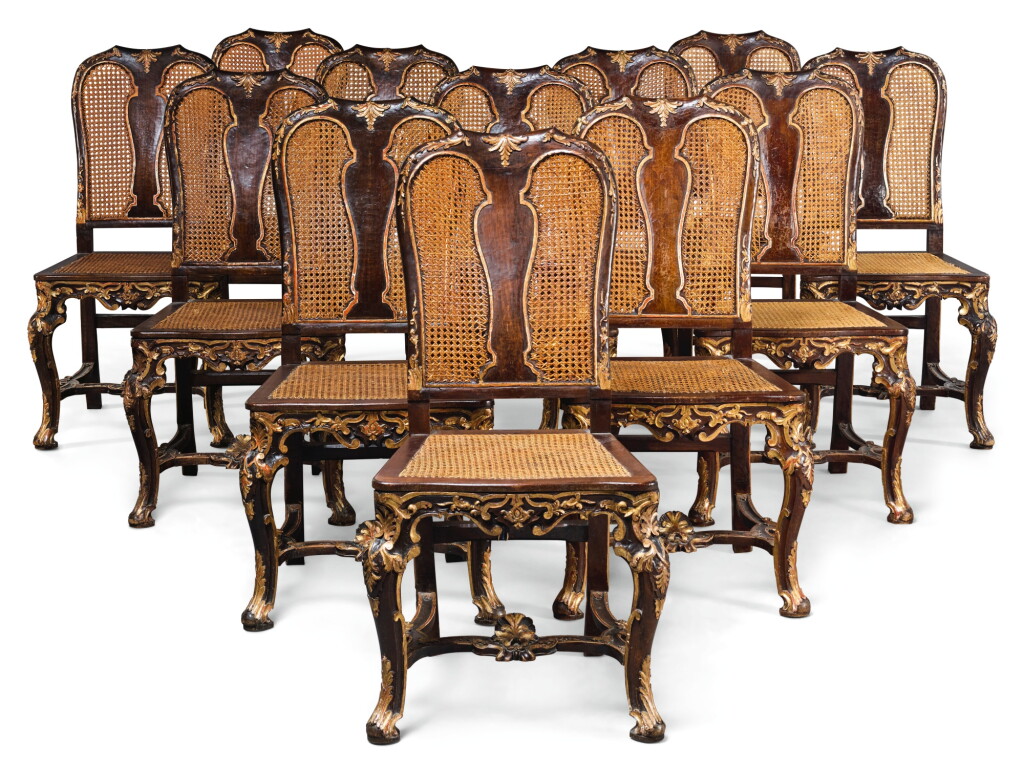 Voir en plein écran - Voir 1 du lot 143. A GROUP OF TWELVE ITALIAN PARCEL-GILT CANED DINING CHAIRS, ROME IN 18TH CENTURY STYLE.