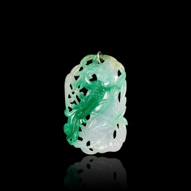 View full screen - View 1 of Lot 443. A jadeite reticulated ‘phoenix and bamboo’ plaque. Qing dynasty 清 翠玉鏤雕鳳鳴在竹牌.