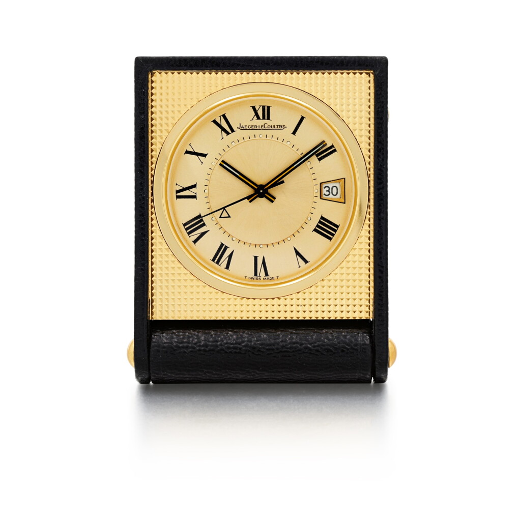 View full screen - View 1 of Lot 21. Reference 11200.71 Brass travel clock with alarm and date Circa 1970.