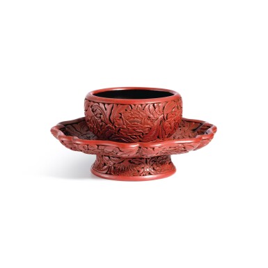 View full screen - View 1 of Lot 3662. An exceptional and important carved cinnabar lacquer bowl stand, Ming dynasty, Hongwu period, Yongle and Xuande marks | 明洪武 剔紅花卉紋盞托 《大明永樂年製》、《大明宣德年製》款.