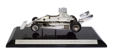 View full screen - View 1 of Lot 193. A parcel-gilt, patinated silver, rubber and enamel model of a Formula One racing car, probably Italian, circa 1976.