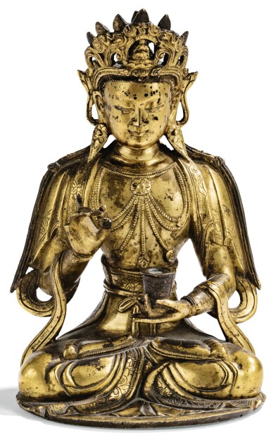 View full screen - View 1 of Lot 148. PETITE STATUETTE DE GUANYIN EN BRONZE DORÉ DYNASTIE MING | 明 鎏金銅觀音坐像 | A small gilt-bronze figure of Guanyin, Ming Dynasty.