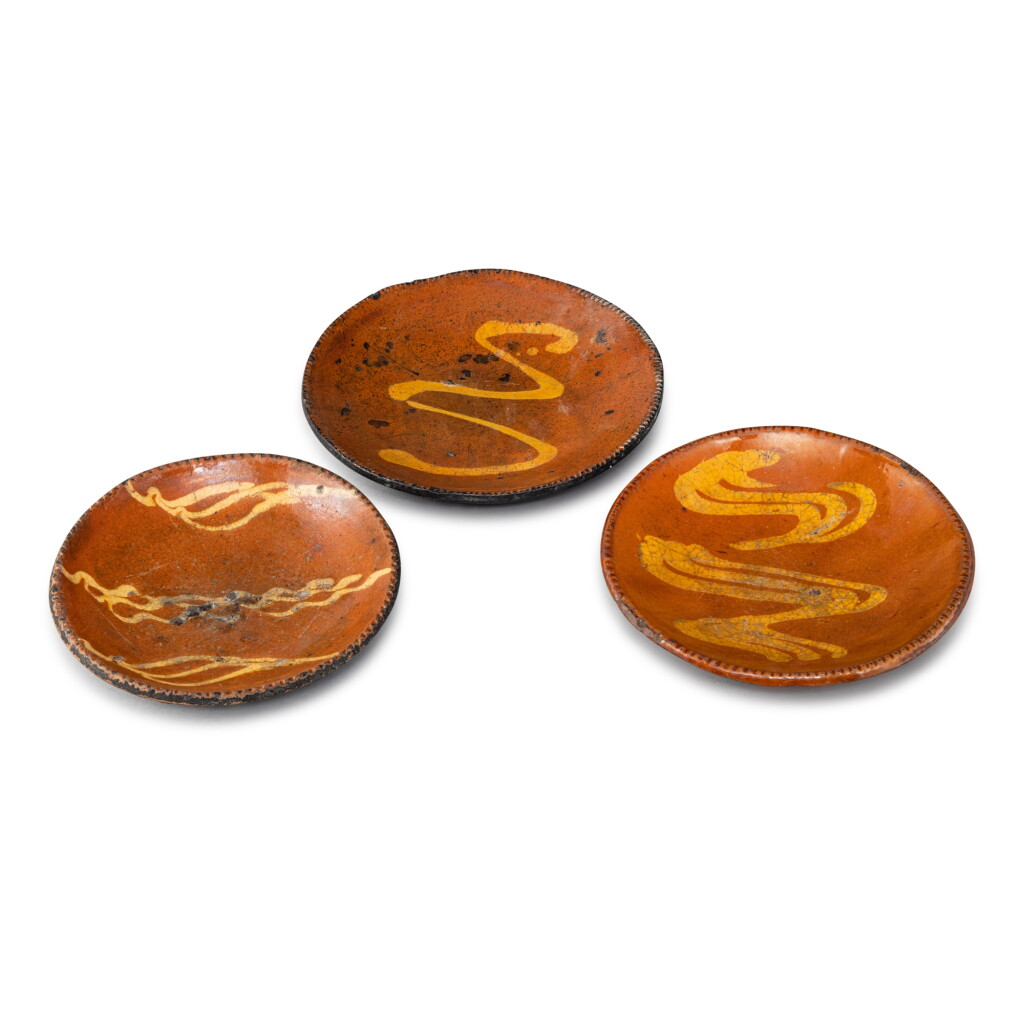 View full screen - View 1 of Lot 31. Three Slip-Decorated Glazed Red Earthenware Salad Plates, Pennsylvania, Early-Mid 19th century.