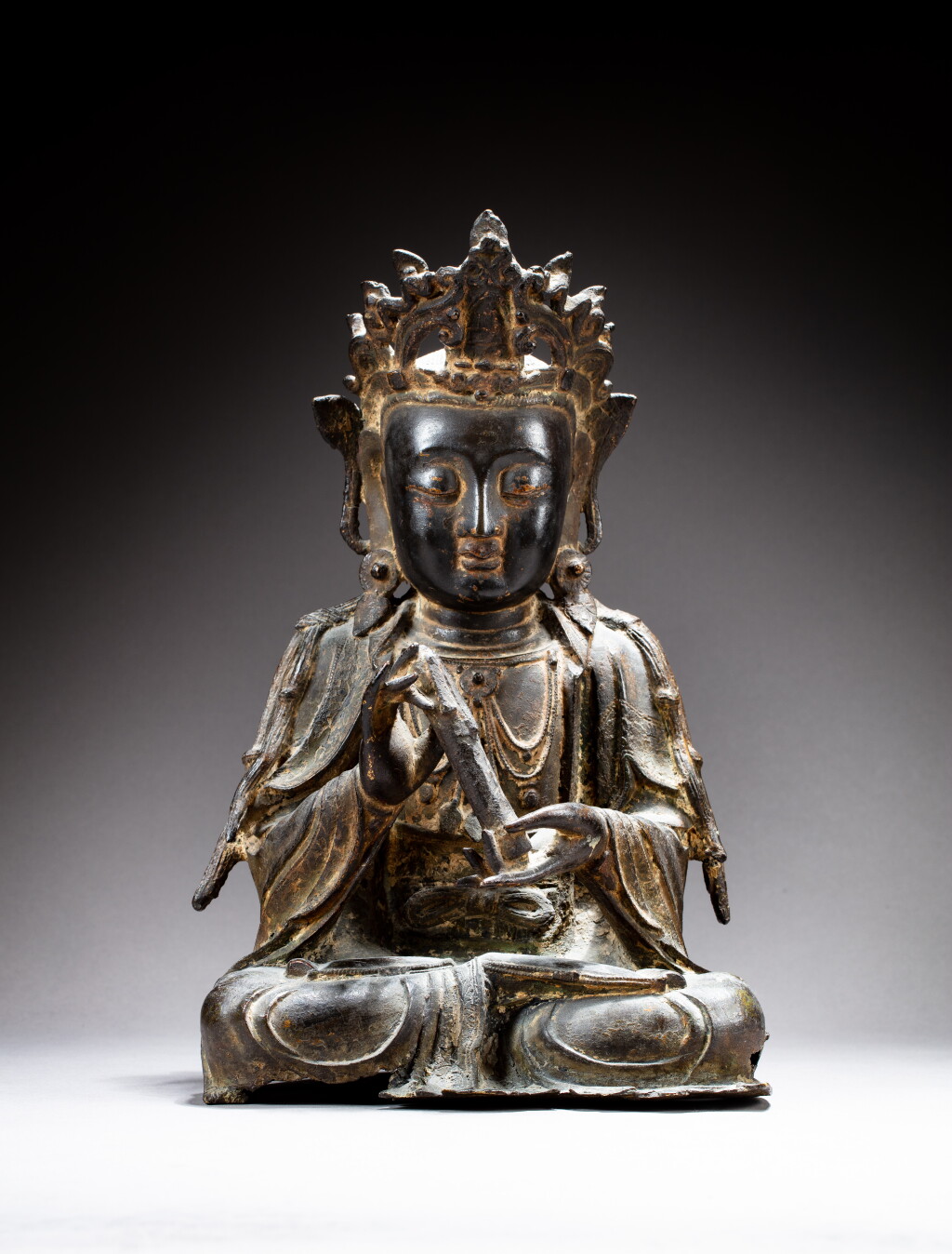 View full screen - View 1 of Lot 110. A bronze figure of seated, Guanyin Ming dynasty | 明 銅鑄觀音坐像.