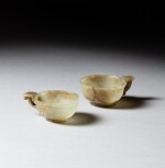 Two pale celadon jade archaistic handled cups, 17th - 18th century | 十七至十八世紀 青白玉仿古盃 一組两件