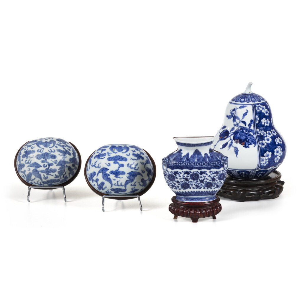 View full screen - View 1 of Lot 232. Three blue and white wall vases and a blue and white underglaze red gourd-shaped ornament, Qing dynasty | 清 青花壁瓶及青花釉裏紅葫蘆擺件一組四件.