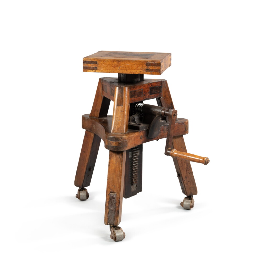 View full screen - View 1 of Lot 111. A walnut artist's sculpture stand | Sellette de sculpteur en noyer.