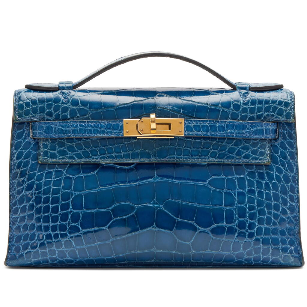 View full screen - View 1 of Lot 22. Bleu Izmir Shiny Mississippiensis Alligator Kelly Pochette Gold Hardware, 2019.