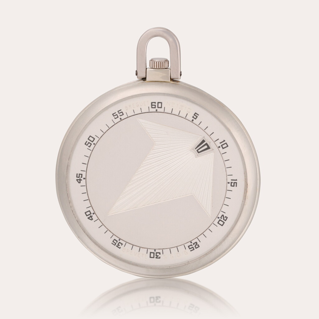View full screen - View 1 of Lot 56. A slim and elegant 18ct white gold open-faced keyless lever jump hour dress watch with presentation case and white gold chain.